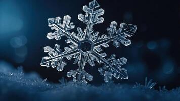 A close-up of a snowflake resting on a surface, showcasing intricate ice crystal patterns. photo