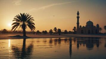 Serene sunset over a mosque and palm trees, reflecting in calm water. photo