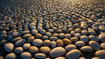 A close-up of smooth, rounded pebbles arranged in a spiral pattern on a surface. photo