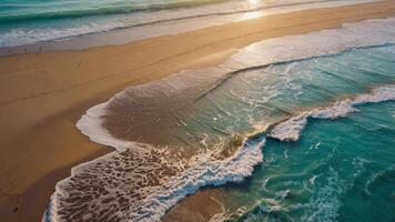 A serene beach scene with gentle waves lapping at the shore during sunset. photo