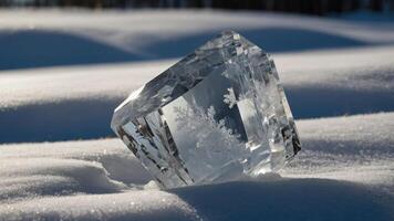 A crystal-like ice sculpture resting on pristine snow, showcasing intricate snowflake patterns. photo