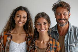 Happy family portrait shows a father and his two daughters smiling photo