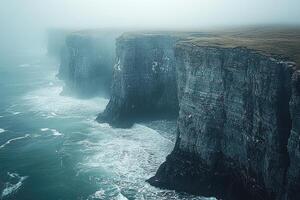 Coastal Cliffs Enveloped In Misty Ocean photo