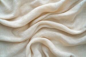 Draped beige linen fabric showing texture and folds photo