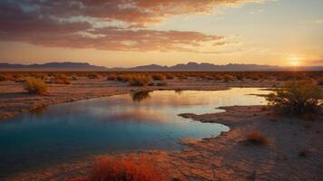 Tranquil desert landscape at sunset with a reflective pool and distant mountains. photo
