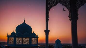 A serene sunset view featuring ornate domes and a crescent moon. photo