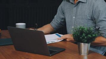 Man working on laptop at desk video
