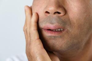 The man has facial swelling due to an allergic reaction to triggers such as insect bites stings.5 photo