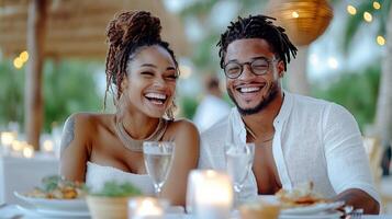 couple enjoying romantic dinner by candlelight, smiling happily photo