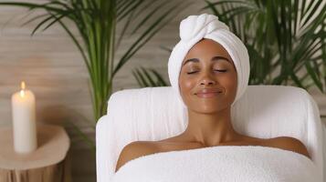 A woman in a towel is relaxing in a spa photo