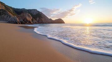 The sun sets over the ocean and waves on a beach photo