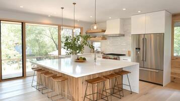 A kitchen with a large island and wooden flooring photo