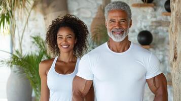 An older man and woman standing in front of a gym photo