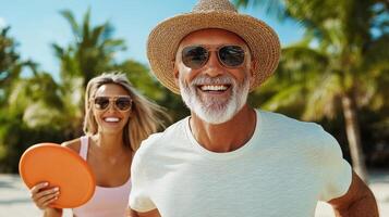 An older man and woman are smiling and holding a frisbee photo