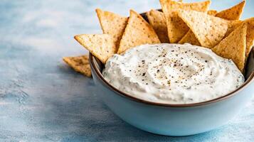 Chips and dip in a bowl photo