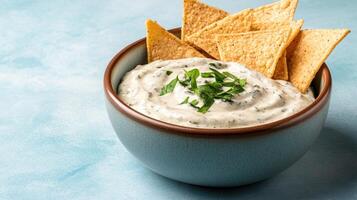Dip with tortilla chips photo