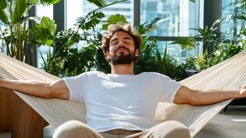 A man relaxing in a hammock photo
