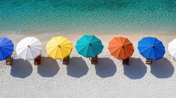 A row of colorful umbrellas on a beach photo