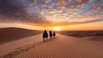 Three people riding camels in the desert at sunset photo