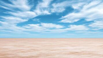 An empty desert with a blue sky and clouds photo