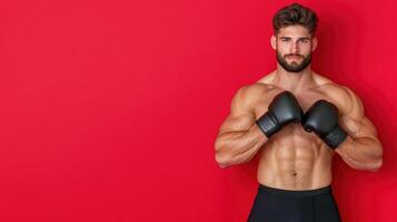Muscular man with boxing gloves on red background photo