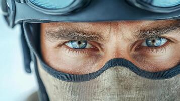 Close up of a man wearing goggles and a mask photo