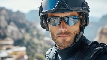 A man wearing a helmet and sunglasses photo