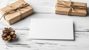 Gift boxes and paper on white wooden background photo