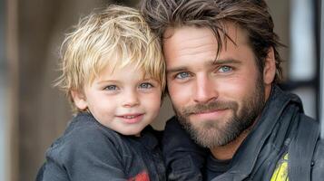 A man and a young boy are posing for a photo