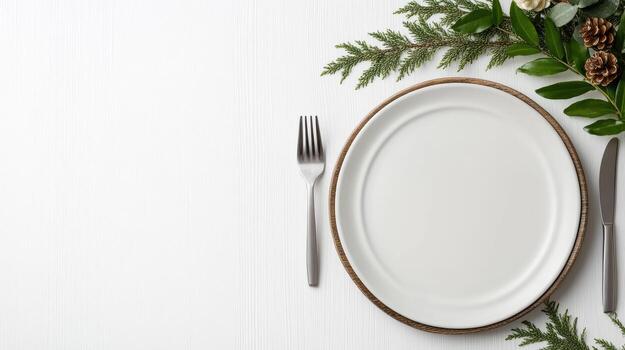 A white plate with silverware and a fork on a wooden table photo
