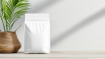 White packaging mockup with plant on wooden table photo
