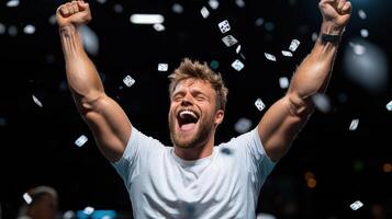 A man celebrating with his arms up in the air photo