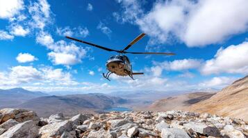 Helicopter flying over mountains with blue sky photo