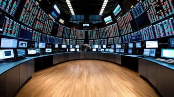 A large room with multiple screens and multiple computers photo