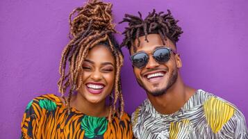 A couple with dreadlocks and sunglasses smiling photo