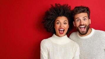 A couple in sweaters are looking at the camera photo