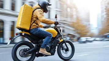 A man in a helmet rides a motorcycle with a box on the back photo