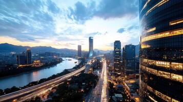 A city with tall buildings and a river at dusk photo