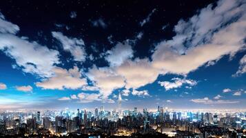 A cityscape at night with clouds and stars photo