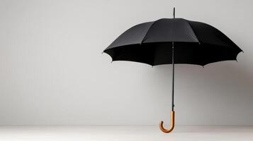 An open black umbrella on a white background photo