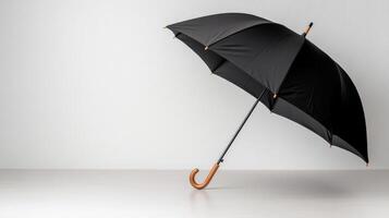 An open black umbrella on a white surface photo