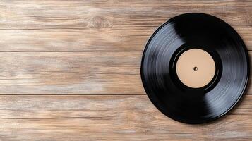 An old vinyl record on a wooden table photo