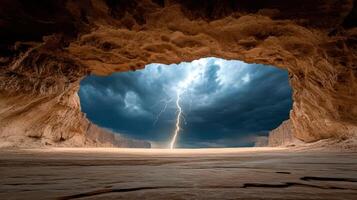 Lightning striking through a cave with a dark sky photo