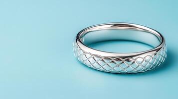 A silver ring with a diamond pattern on it photo
