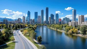 A city skyline with a river and trees photo