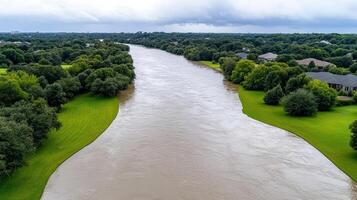 Flooding in the river near a neighborhood photo