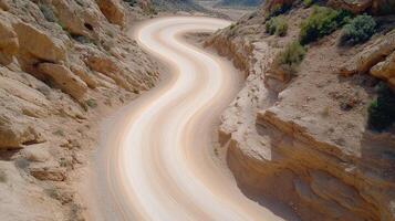 A long, winding road in the desert photo