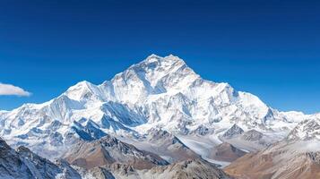The mountain peak of the everest is seen in the background photo
