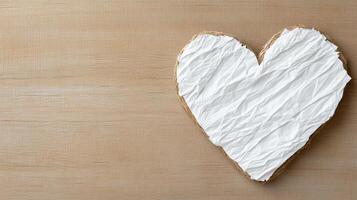 A heart shaped cookie on a wooden surface photo