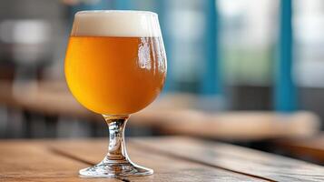 A glass of beer on a table photo